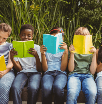 2026 Summer Reading Programs In & Around Austin children reading outdoors